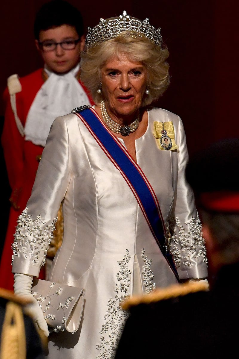 The queen consort, in a cream silk gown and tiara, attends the State Opening of Parliament in London on on October 14, 2019. AFP