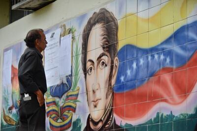 A man looks for his names moments before casting his vote at a polling station during presidential elections in Barquisimeto on May 20, 2018 Venezuelans headed to the polls early Sunday to vote in the general elections as incumbent president Nicolas Maduro is seeking a second term in power. / AFP / Luis Robayo                         
