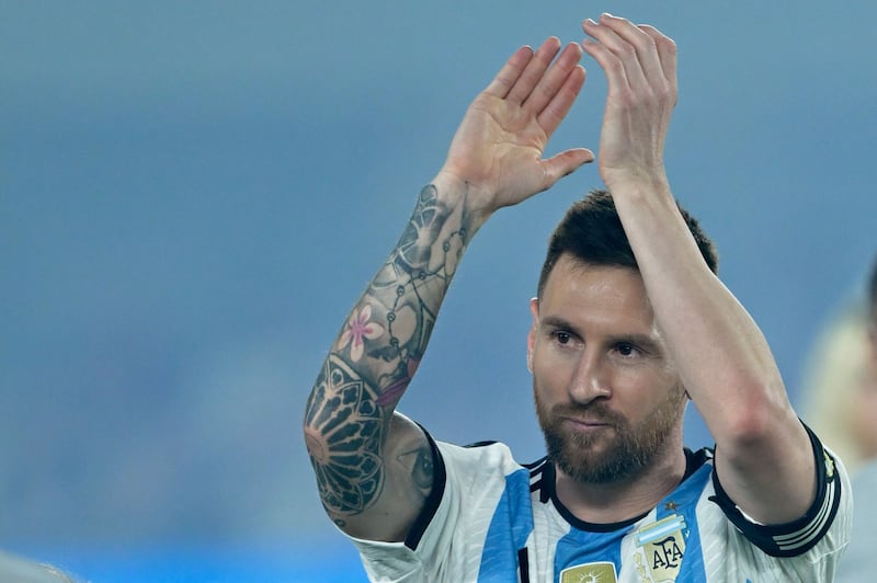 Argentina's forward Lionel Messi applauds fans after the national anthems ceremony. AFP