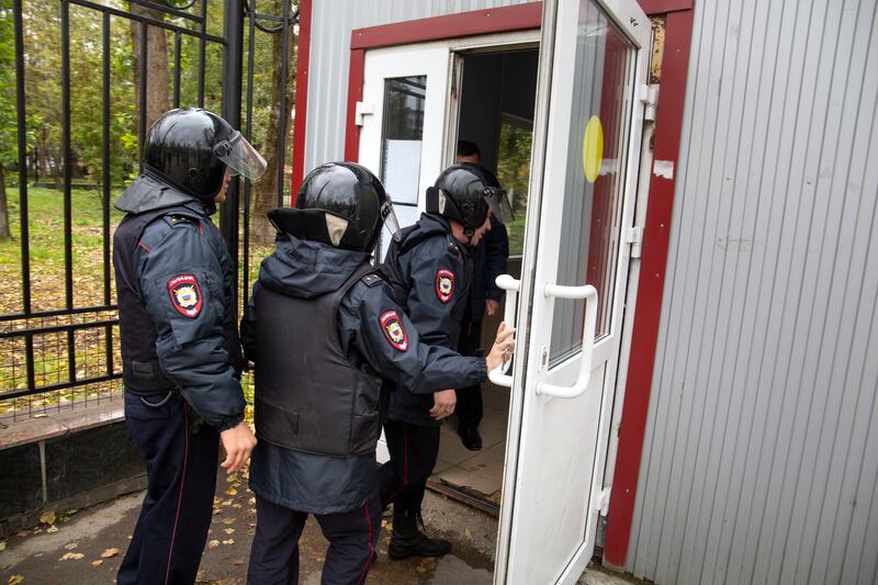 Police officers enter Perm State University. AP