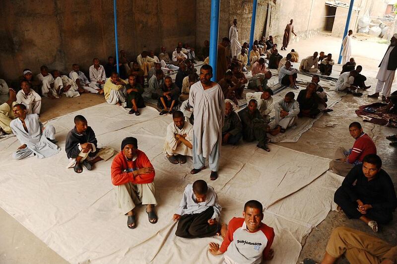 Afghan men rest in the female ward at the only mental health rehabilitation centre in the city of Herat, Afghanistan.