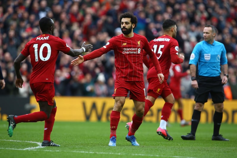 Liverpool's Mohamed Salah celebrates with teammates after scoring at Anfield. AFP