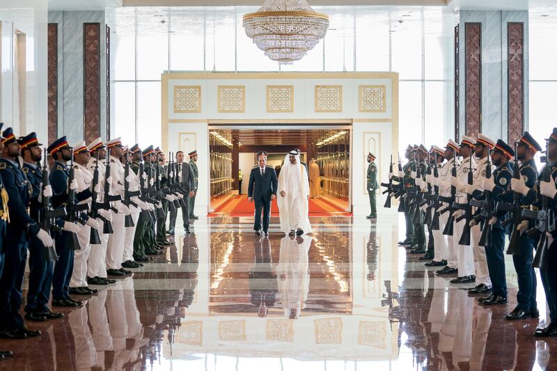 ABU DHABI, UNITED ARAB EMIRATES -September 25, 2017: HH Sheikh Mohamed bin Zayed Al Nahyan Crown Prince of Abu Dhabi Deputy Supreme Commander of the UAE Armed Forces (center R), receives HE Abdel Fattah El Sisi, President of Egypt (center L), at the Presidential Airport. 

( Rashed Al Mansoori / Crown Prince Court - Abu Dhabi )
---