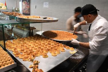 Al Sultan Sweets, founded by Syrian immigrants in the UAE, is among the places that will deliver during Ramadan. AFP