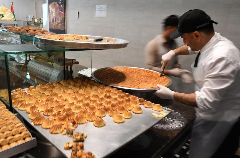The al-Sultan sweets shop, founded by Syrian immigrants in the UAE, is pictured on May 28, 2019 during the Muslim holy month of Ramadan.  / AFP / KARIM SAHIB

