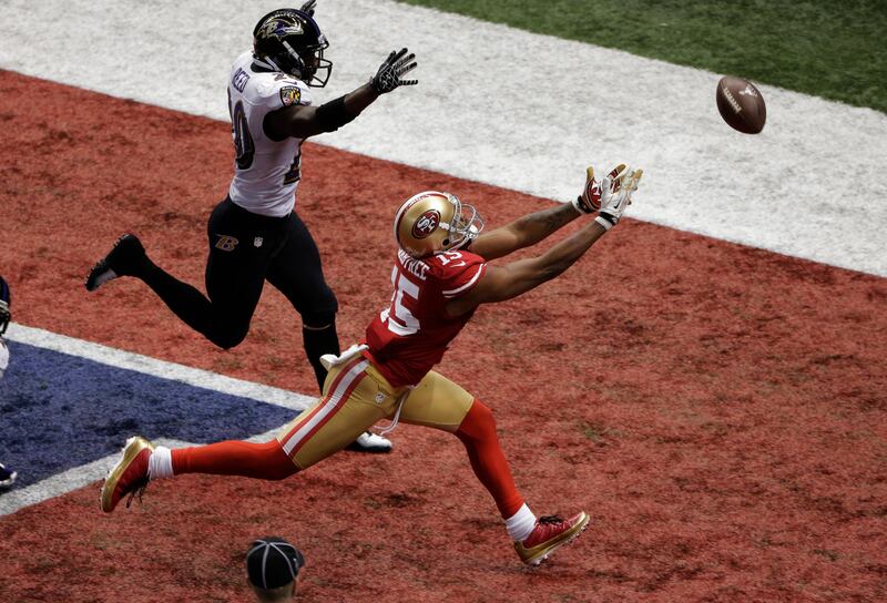 San Francisco 49ers wide receiver Michael Crabtree (15) cannot reach a pass thrown on fourth-and-goal as Baltimore Ravens safety Ed Reed (20) defends late in the fourth quarter of the NFL Super Bowl XLVII football game, Sunday, Feb. 3, 2013, in New Orleans. (AP Photo/Charlie Riedel)  *** Local Caption ***  APTOPIX Super Bowl Football.JPEG-0cedd.jpg