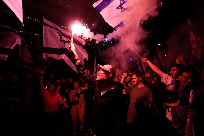 Israelis block a road in Tel Aviv. AP