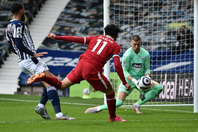 West Brom goalkeeper Sam Johnstone saves from Mohamed Salah. AP