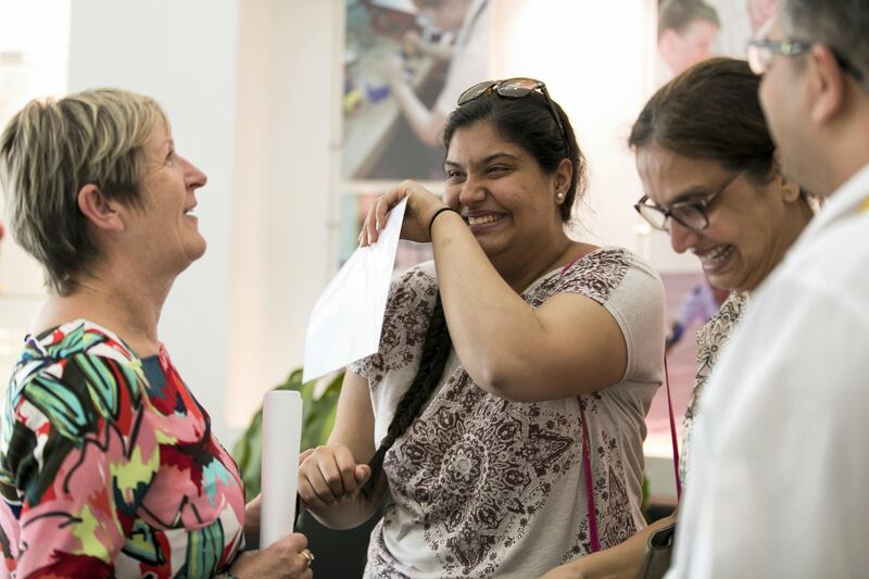 DUBAI, UNITED ARAB EMIRATES - AUG 17: 
Devika Dahiya cries in joy upon learning here A-level examination results at Jumeirah College School 


(Photo by Reem Mohammed/The National)

Reporter:  Caline Malek
Section: NA