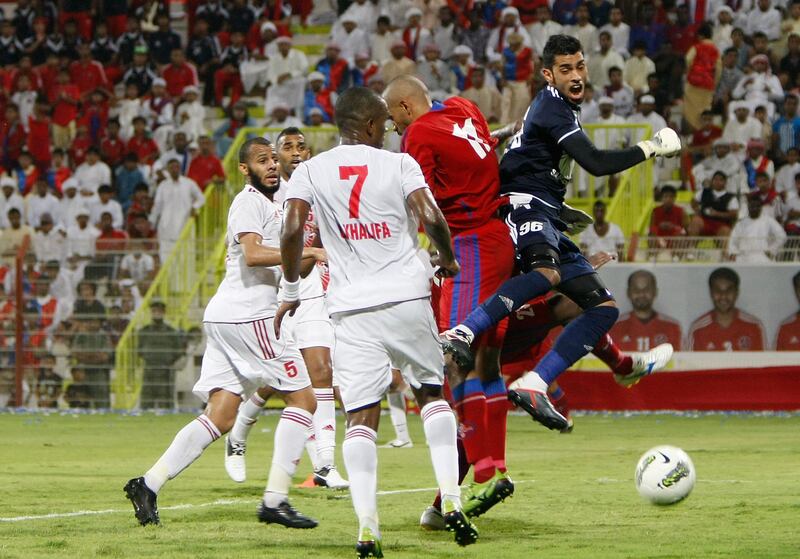 Dubai, United Arab Emirates - September 9, 2012.  Al Sharjah players against a lone Al Shaab player.  ( Jeffrey E Biteng / The National )