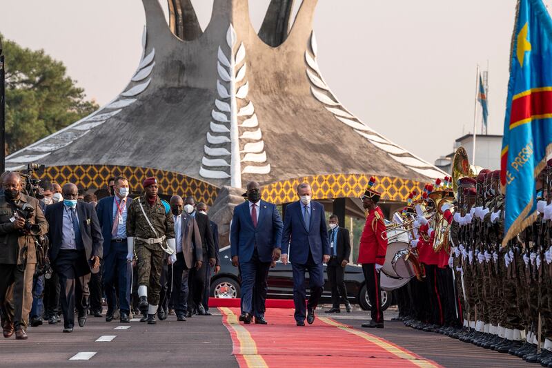 Mr Tshisekedi, left, greets Mr Erdogan at the Palais de la Nation in Gombe, Lukunga district of Kinshasa. AFP