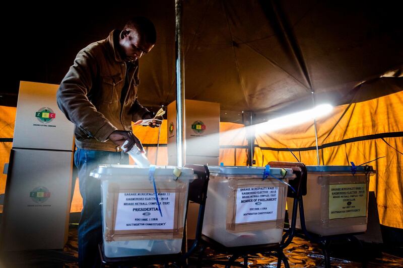A man casts his ballot in a polling station located in the suburb of Mbare in Zimbabwe's capital Harare during the first round of general elections. Luis Tato/AFP