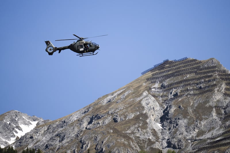 A police helicopter patrols the venue.