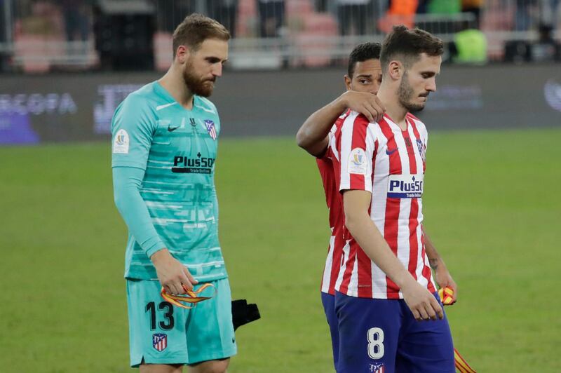 Atletico Madrid players react at the end of the Spanish Super Cup Final soccer match between Real Madrid and Atletico Madrid at King Abdullah stadium in Jeddah, Saudi Arabia, Monday, January 13, 2020. AP Photo/Hassan Ammar
