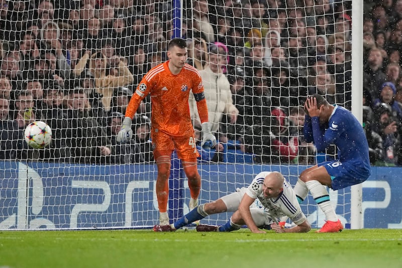 Chelsea's Thiago Silva, right reacts after missing a chance. AP