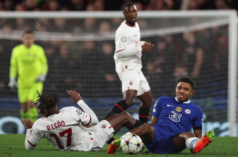 Wesley Fofana goes down after a challenge from Milan's Rafael Leao that would see the Chelsea defender limp off. EPA