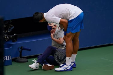Novak Djokovic, of Serbia, checks a lineswoman after hitting her with a ball in reaction to losing a point to Pablo Carreno Busta, of Spain, during the fourth round of the US Open. AP Photo