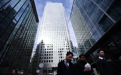 International banks tower over pedestrians in London's financial district, in Canary Wharf. EPA