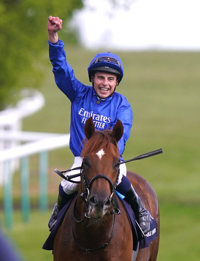 William Buick celebrates after the race. PA 