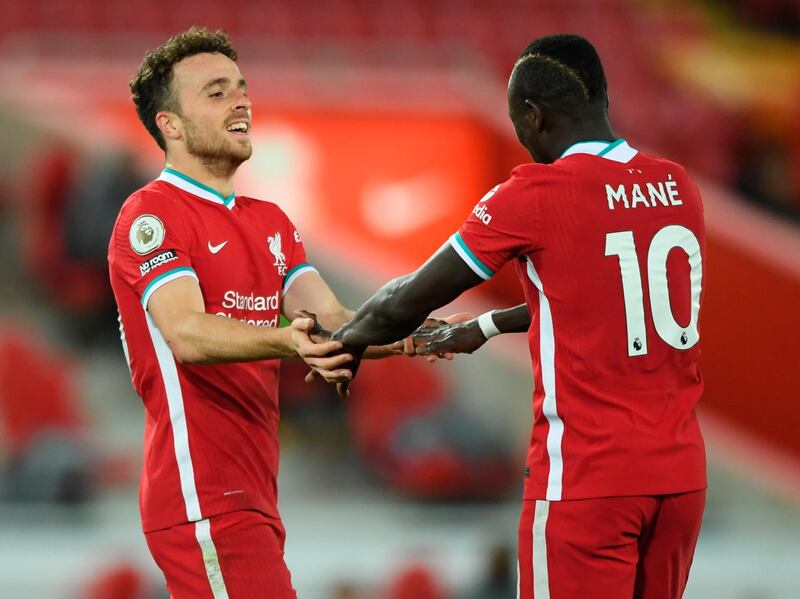 Liverpool's Diogo Jota celebrates with teammate Sadio Mane after scoring. EPA