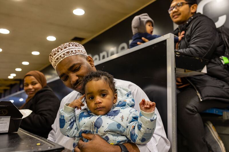 Imam Said with his son at the iftar reception