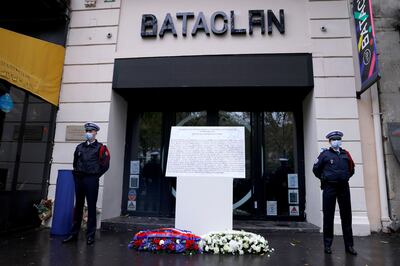 French police officers stand during a ceremony to pay tribute to those killed in the November 13, 2015, attacks in front of the Bataclan theatre in Paris. Reuters