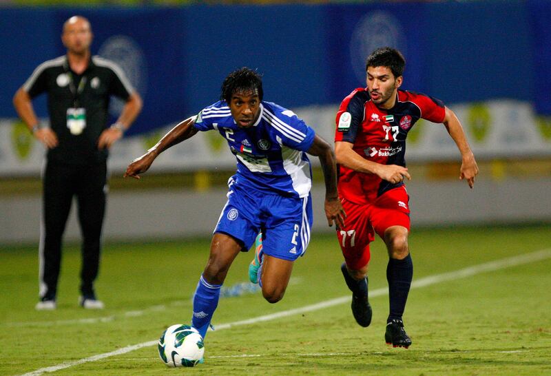 Masoud Hassan of Al Nasr holds off Hassan Maatouk of Al Shaab during the Etisalat Pro League match between Al Nasr and Al Shaab at Zabeel Stadium, Dubai on the 3rd November 2012. Credit: Jake Badger for The National