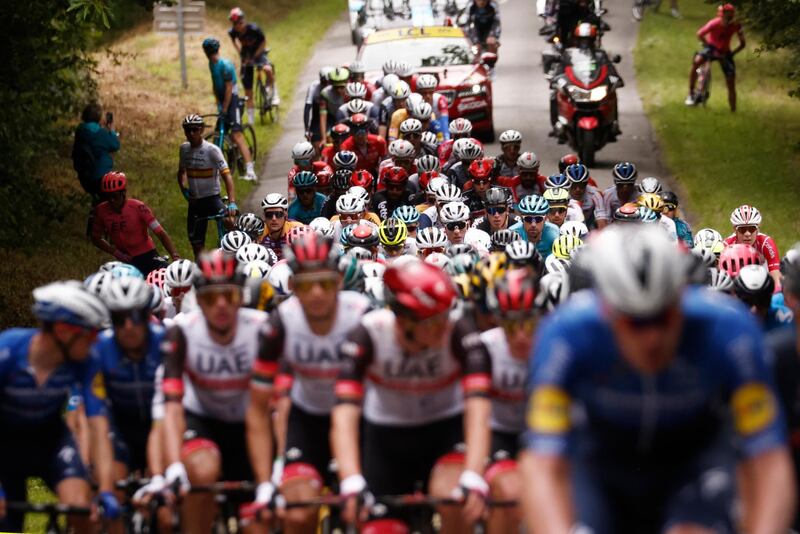 Tadej Pogacar and his UAE Team Emirates teammates in the peloton.