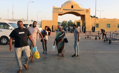 Passengers fleeing the fighting in Sudan arrive at the Argeen overland crossing on the Egyptian border. EPA