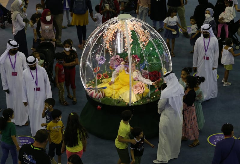People gather at a stand during the Sharjah Children's Reading Festival. EPA
