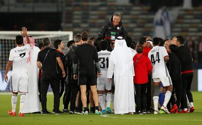 Soccer Football - FIFA Club World Cup - Al Jazira vs Urawa Red Diamonds - Zayed Sports City Stadium, Abu Dhabi, United Arab Emirates - December 9, 2017   Al Jazira players celebrate by attempting to throw coach Henk ten Cate in the air at the end of the match    REUTERS/Matthew Childs