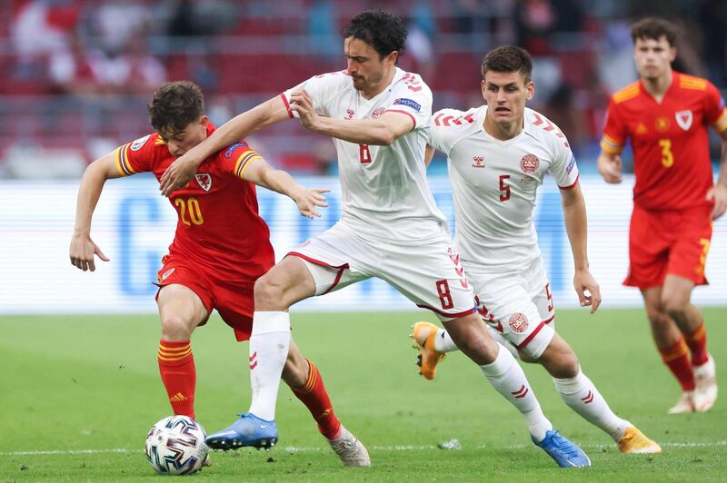 Denmark's midfielder Thomas Delaney pressures Wales' midfielder Daniel James. AFP