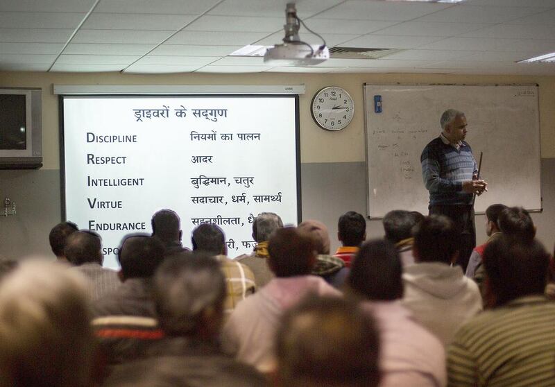 Indian auto-rickshaw drivers attending a gender sensitisation training programme at a city transport department centre on the outskirts of New Delhi on December 12, 2014. The class aims to help the men 'respect and protect women' while plying the streets of New Delhi, dubbed India's rape capital. Rebecca Conway/AFP Photo

