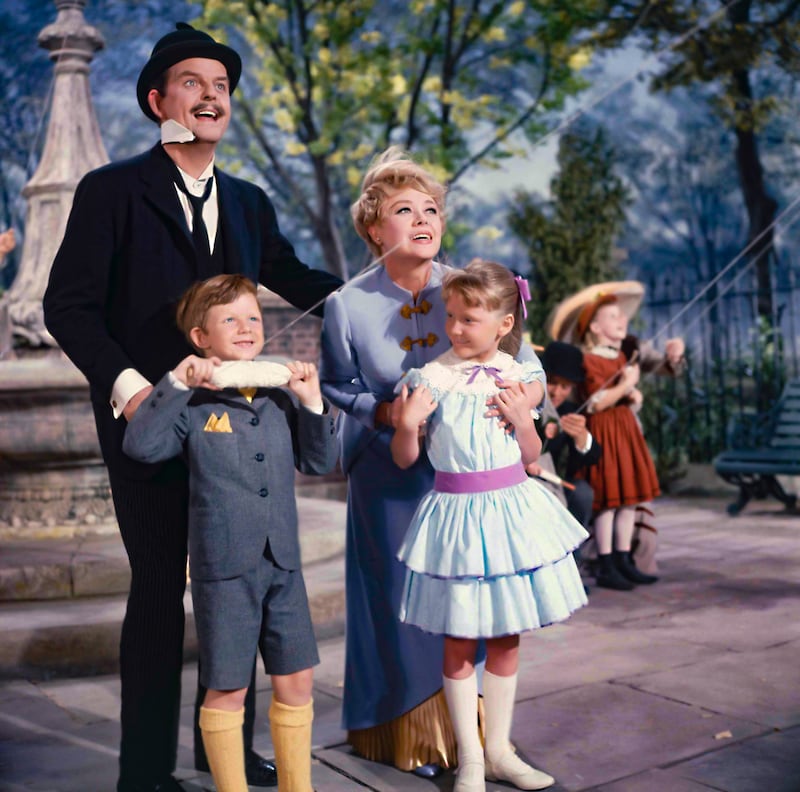 Actors David Tomlinson, Glynis Johns, Matthew Garber and Karen Dotrice in a scene from the movie Mary Poppins
