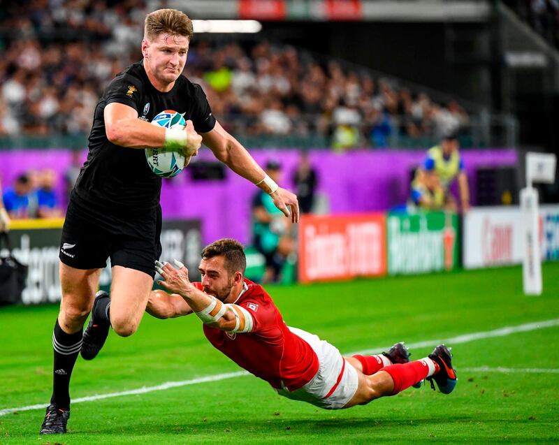 New Zealand's wing Jordie Barrett (L) breaks a tackle from Canada's full back Patrick Parfrey during the Japan 2019 Rugby World Cup Pool B match between New Zealand and Canada at the Oita Stadium in Oita. AFP