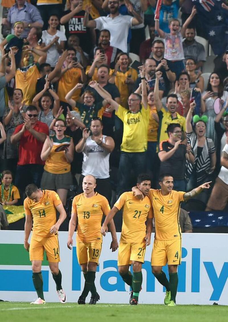 Tim Cahill, right, celebrates after coming off the bench and grabbing Australia’s goal in a 1-0 win over UAE at Mohammed bin Zayed Stadium on September 6, 2016 in Abu Dhabi, United Arab Emirates. (Tom Dulat / Getty Images