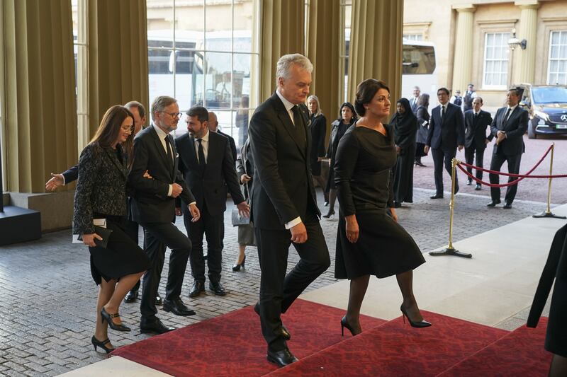 World leaders and heads of state arrive for the reception at Buckingham Palace in London. PA