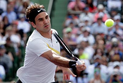 Roger Federer, of Switzerland, returns to Thanasi Kokkinakis, of Australia, during the Miami Open tennis tournament, Saturday, March 24, 2018, in Key Biscayne, Fla. (AP Photo/Lynne Sladky)