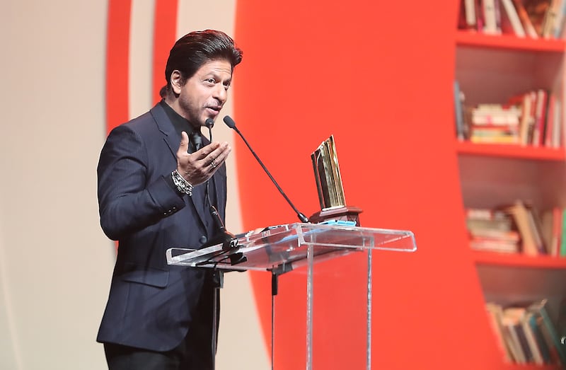 Bollywood star Shah Rukh Khan accepts the first Global Icon of Cinema and Cultural Narrative Award at the Sharjah International Book Fair. All photos: Pawan Singh / The National 