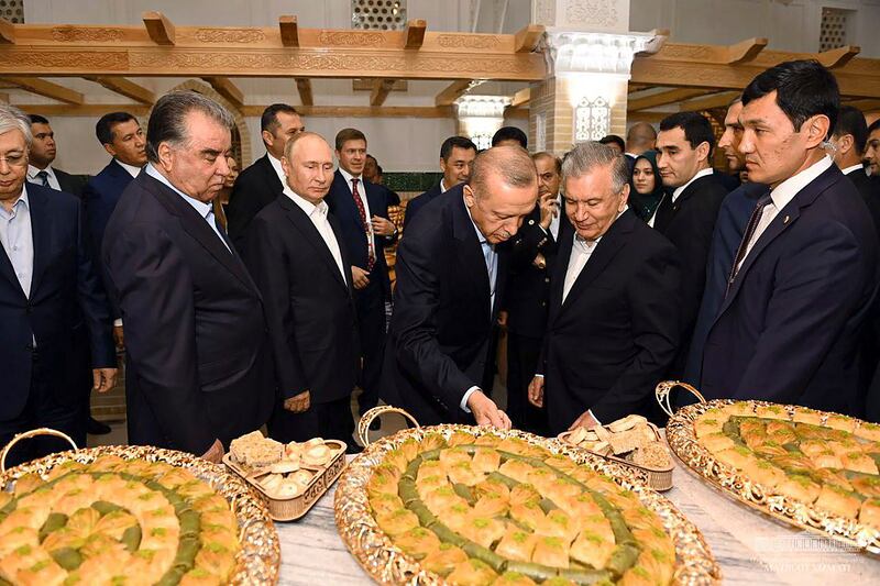From left, Mr Tokayev, Mr Rahmon, Mr Putin, Turkish President Recep Tayyip Erdogan and Mr Mirziyoyev visit a tourist centre on the sidelines of the summit. EPA