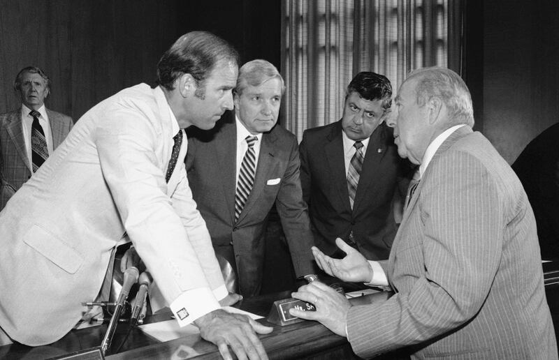 Secretary of State designate George Shultz, right, speaks with members of the Senate Foreign Relations Committee on Capitol Hill in Washington on July 13, 1982. From left are senators Joseph Biden, Charles Percy and Edward Zorinsky. AP