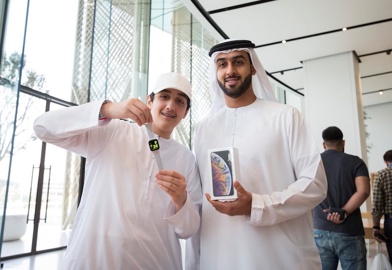 DUBAI, UNITED ARAB EMIRATES, 21 SEPTEMBETR 2018 - Brothers Faisal and Khalid Al Jaziri got a Apple watch series 4 and iPhone xs  at the launch of iPhone XS at Apple store, Dubai Mall.  Leslie Pableo for The National for Alkesh Sharma’s story