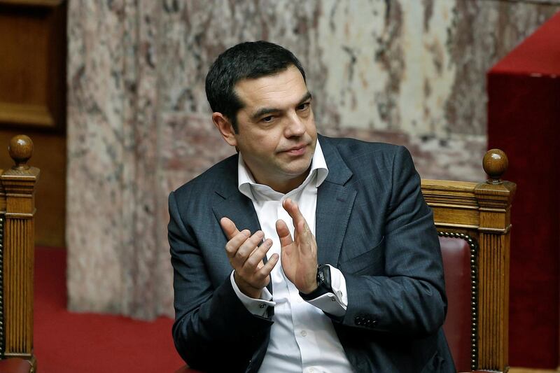 Greek Prime Minister Alexis Tsipras applauds after a speech of Greek Alternate Minister of Foreign Affairs George Katrougalos (not pictured) during a parliament session before a vote on an accord between Greece and Macedonia changing the former Yugoslav republic's name in Athens, Greece, January 25, 2019. REUTERS/Costas Baltas