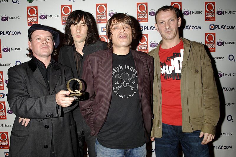 Scottish rock band Primal Scream with their Q Groundbreaker Award during the Q Awards 2006, in London. Martin Duffy, left, who played the keyboard for Primal Scream and The Charlatans, has died aged 55. PA
