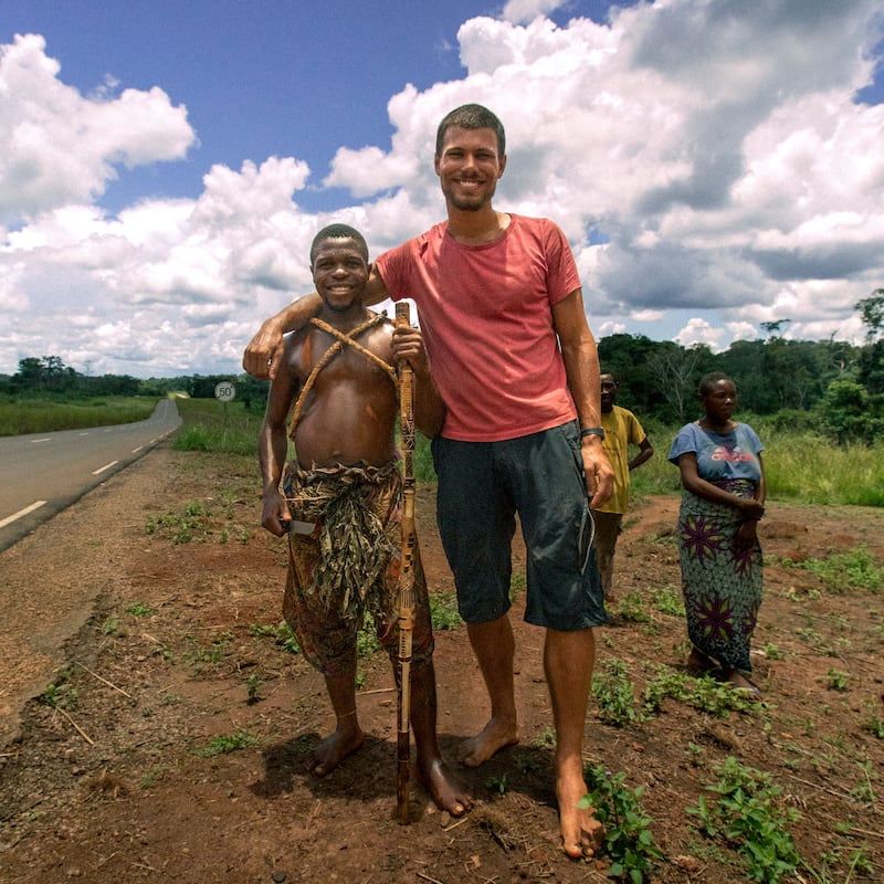 Guss van Veen, right, who was part of the support crew, is all smiles with locals during the mission