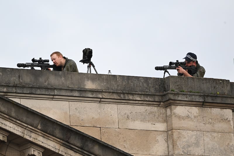 Armed Metropolitan Police officers on roof of Buckingham Palace. EPA