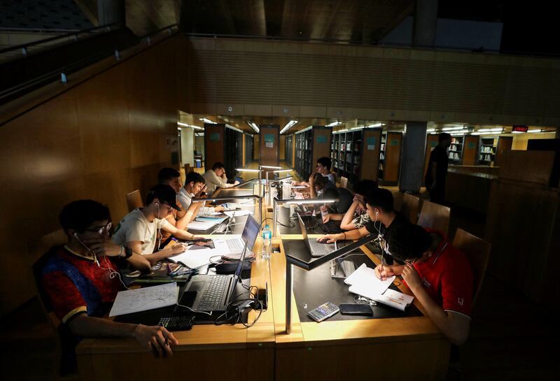 Students study for their high school certificate exams at the Library of Alexandria during the rolling electricity power cuts introduced by Egyptian authorities to compensate for a shortage of fuel for its power stations. Reuters