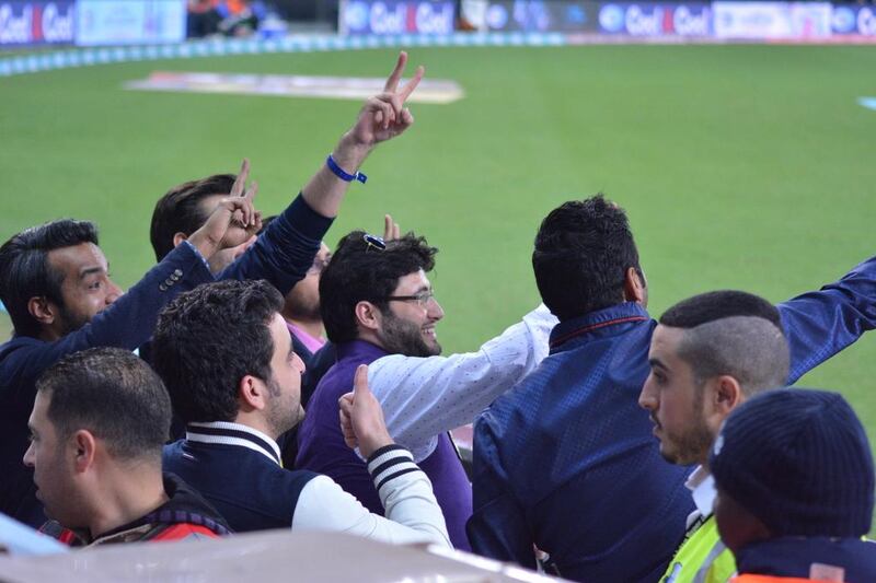 Fans cheer at Dubai International Cricket Stadium on Saturday during the Pakistan Super League T20 match between Peshawar Zalmi and Lahore Qalandars. Photo Courtesy / PSL