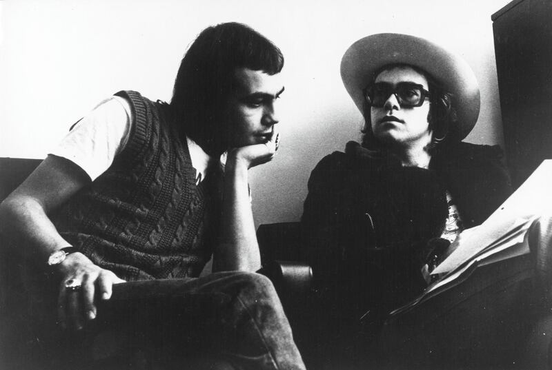 LONDON - CIRCA 1973: Pop singer Elton John and his lyricist Bernie Taupin (left) pose for a portrait in circa 1973 in London, England. (Photo by Michael Ochs Archives/Getty Images)