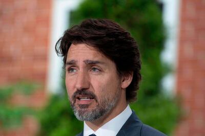 (FILES) In this file photo taken on June 25, 2020 Canadian Prime Minister Justin Trudeau speaks during his daily coronavirus, COVID-19  briefing at Rideau Cottage in Ottawa, Ontario. Canadian Prime Minister Justin Trudeau said October 20, 2020 his children will not go trick-or-treating on Halloween this year due to Covid-19 restrictions, but may instead hunt "Easter-style" for candy around their house. / AFP / Lars Hagberg
